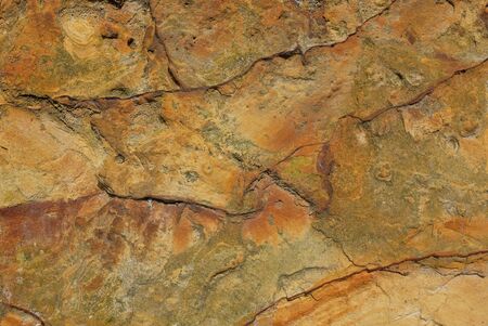 Rough, weathered sandstone surface as abstract background texture