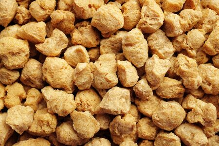 Soya protein chunks used in vegetarian and vegan food as an abstract background textureの写真素材