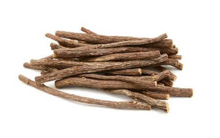 Large pile of liquorice root sticks, isolated on a white backgroundの写真素材