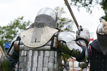 TONBRIDGE, ENGLAND - SEPTEMBER 8, 2018: Fighters in Medieval battle armour take part in full contact combat at a fair held at Tonbridge Castleのeditorial素材