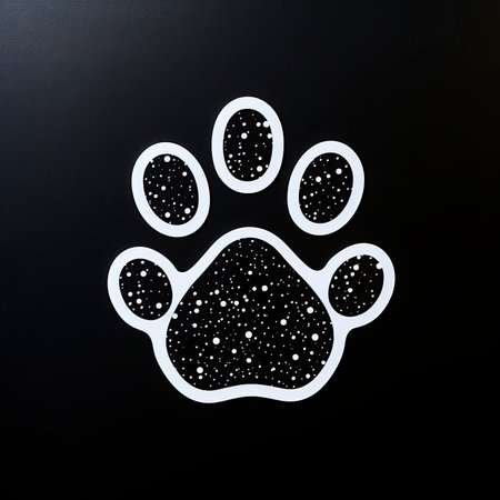 Paw print on a black background. Footprint on a black background.の素材