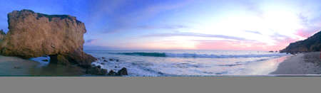 Panoramic view of a beach at sunsetの写真素材