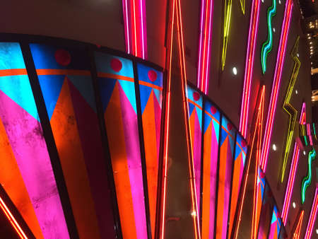 Colorful neon lights on the ceiling of a building in the cityの写真素材
