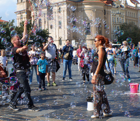 Prague, Czech Republic - September 23, 2016 - An unidentified people having fun with soap bubbles on Old Town Square.のeditorial素材