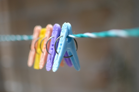 Colorful plastic clothes pin on an outdoor clothes line in Playa del Carmen, Mexico  の写真素材