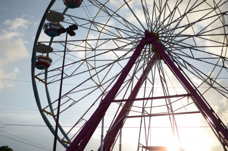 The silhouette of a ferris wheel against a Playa del Carmen sunset in Mexico  の写真素材