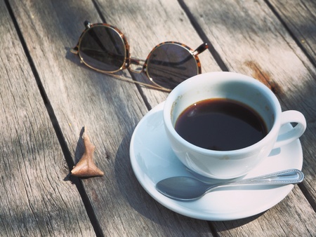 A cup of coffee on the table in the morning.の写真素材