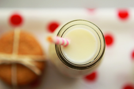 Close up of a bottle of fresh milk with baked oatmeal biscuitsの写真素材