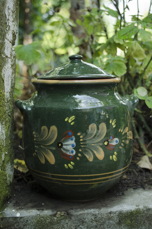 Clay pot for meat dishes, soup, beans. Colorful earthenware pot for cooking.の写真素材