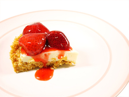 Strawberry cheese pie on white plateの写真素材