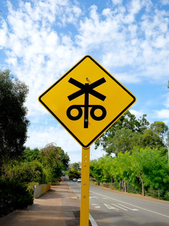 Yellow railway crossing signの写真素材
