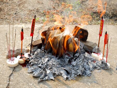 Ancestor offering burning at cemetery on Tomb Sweeping Dayの写真素材