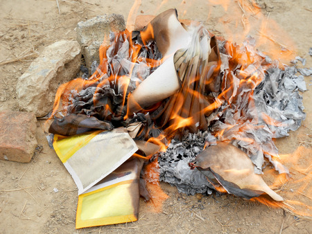 Ancestor offering burning at cemetery on Tomb Sweeping Dayの写真素材