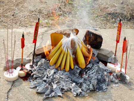 Ancestor offering burning at cemetery on Tomb Sweeping Dayの写真素材