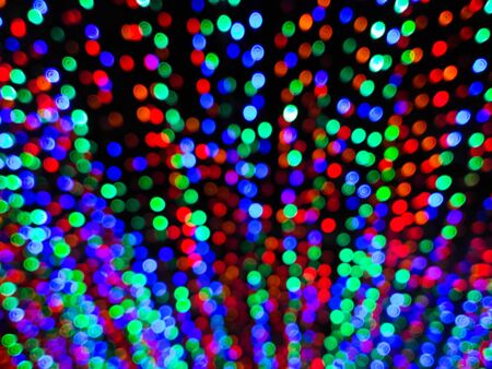 Blurred colorful bokeh at nightの写真素材