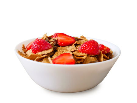 Cereal breakfast with raisin and fresh strawberries isolated on white background (with clipping path)の写真素材