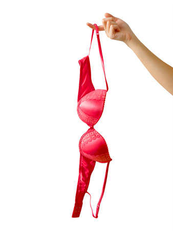 Woman holding red bra isolated on white backgroundの写真素材