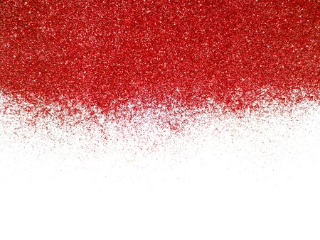 Blurred red glitter isolated on white background with copy spaceの写真素材