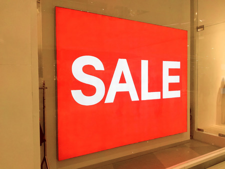 Huge sale sign in clothing shop in shopping mallの写真素材