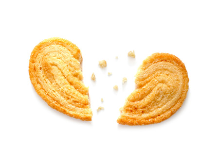 Broken hearted cookie isolated on white background