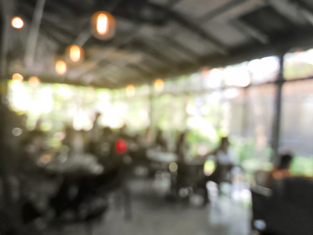 Blurred people dinning in the restaurantの写真素材