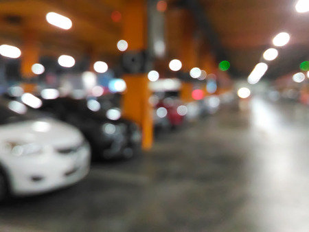 Blurred cars in car park or parking lot in shopping mallの写真素材