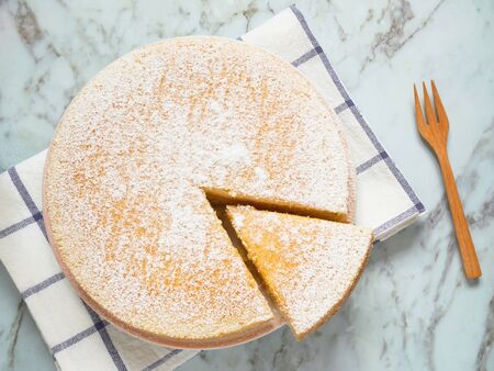 Homemade yogurt cake with icing sugar.の写真素材