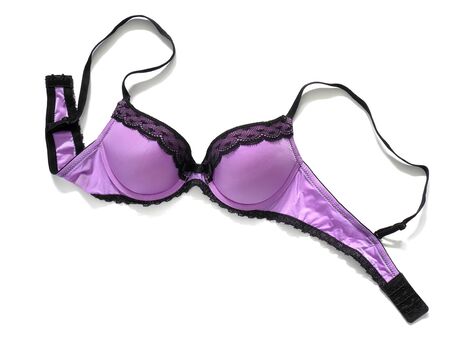 Purple bra with black lace isolated on whiteの写真素材