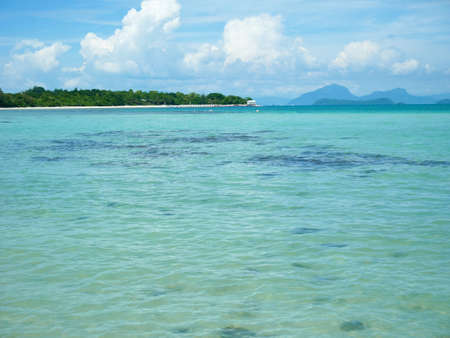 Longtail boat on crystal clear water on a sunny day in Koh Mudsum, Samuiの写真素材