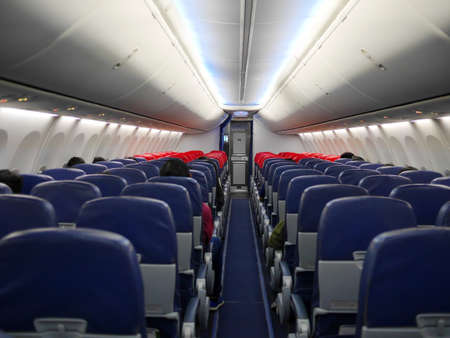 Interior and passengers on the planeの写真素材