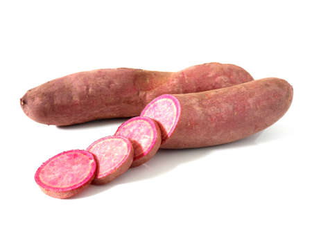 Fresh purple sweet potatoes isolated on whiteの写真素材
