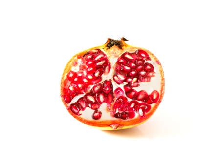 Ripe pomegranate isolated on white backgroundの写真素材