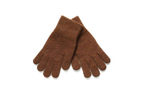 Brown knitted gloves isolated on white background