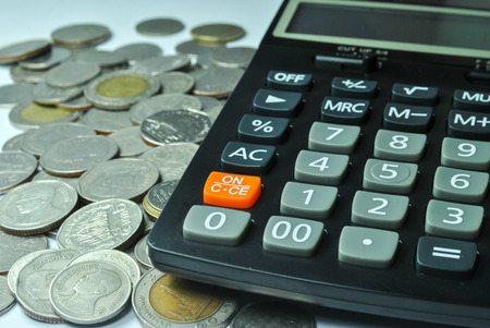 part of calculator and money coin tahiの写真素材