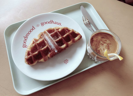waffle and coffee on the table, vintage color tone style.