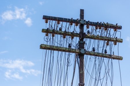 Antique telephone pole with glass insulatorsの写真素材