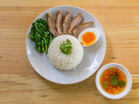 BBQ duck over steamed rice.の写真素材