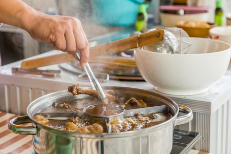 The duck stewed in the gravy sauce ready for sale in Thailand.の写真素材