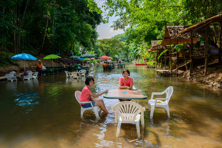 CHIANGMAI, THAILAND - SEPTEMBER 13 : Restaurants serving food and beverages, including coffee and bakery on middle of the stream river. September 13, 2014 in  CHIANGMAI, THAILANDのeditorial素材