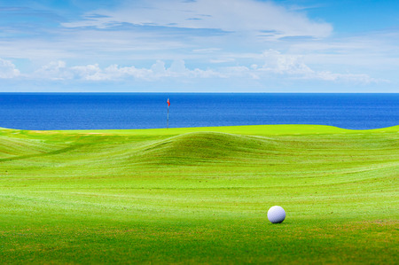 golf ball on green.の写真素材