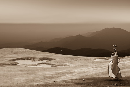 golf equipment on green and hole as background. vintage toneの写真素材