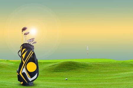 golf equipment on green and hole as background. vintage toneの写真素材