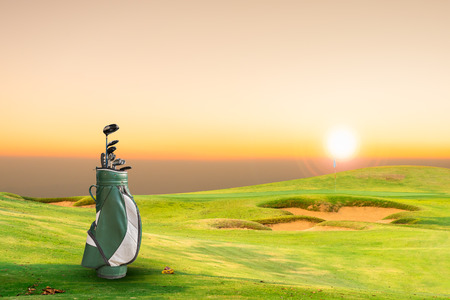 golf equipment on green and hole as background. vintage toneの写真素材