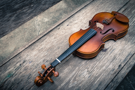 Violin Musical Instrument Lying on a Wooden Floor.の写真素材