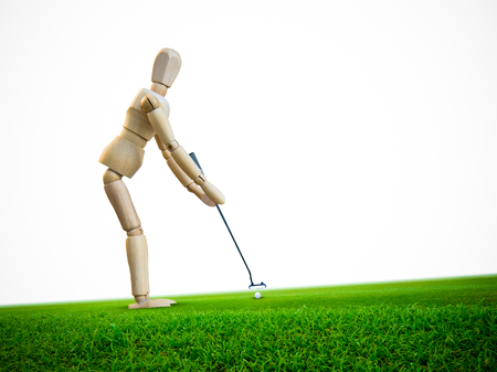 Wooden dummy doll, Wood figure isolated on white background in concept of Golfer  putting golf ball on green  with space for text.の写真素材