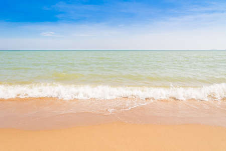 Abstract beach background. Yellow sand, blue sky and calm tropical beach landscape.Exotic nature concept.Location Satheep Thailand.の写真素材