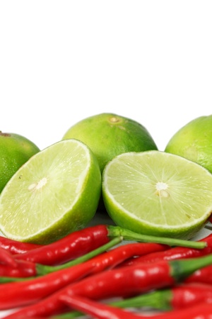 Red chili and limesの写真素材