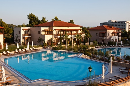 Luxury swimming pool with white fashion deckchairsのeditorial素材