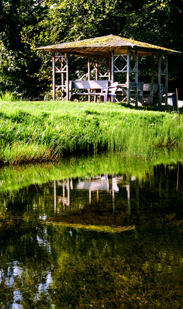 wooden gazebo in the lakeの写真素材