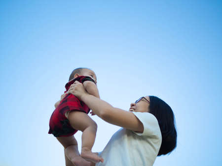 moms and sons have a special relationship.Mothers play various roles in the life of their sons. A mother is her son's best friend, his protector and hope, a source of encouragement.の写真素材